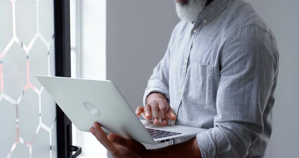 Businessman using laptop at office 