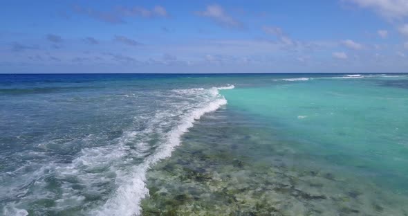 Wide angle drone abstract shot of a summer white paradise sand beach and turquoise sea background in