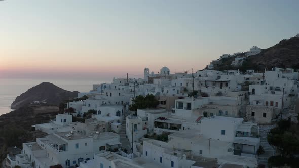 Beautiful Aerial View Over Generic Greek Village Small Town with Ocean View, Sunset