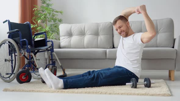 Disabled Sportsman Doing Stretching and Exercises on Wheelchair Background