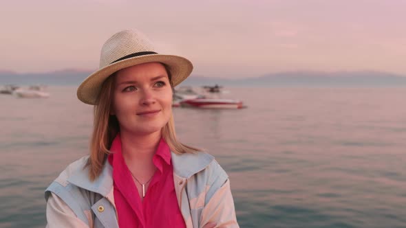 Happy Young Woman Enjoying Life on Lake Tahoe at Pink Sunset  Slow Motion