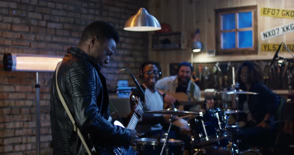 Young Musicians Rehearsing in Garage