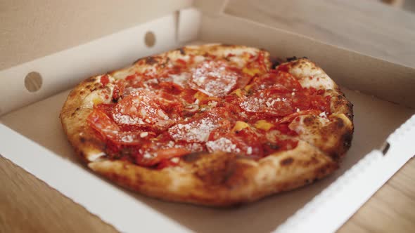 Hands Taking Pieces of Traditional Italian Pizza From Delivery Open Box Food Delivery Service to