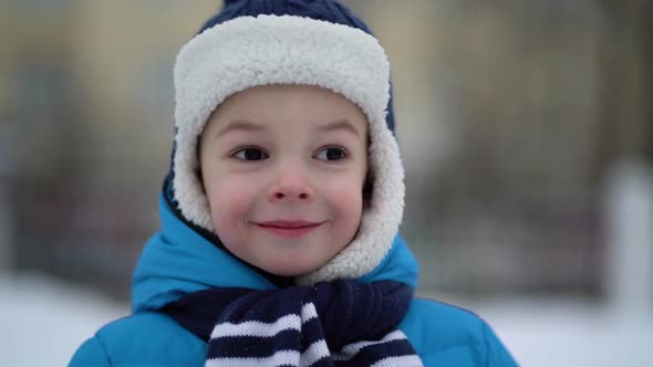 Cute Four Years Old Boy Portrait on Winter Forest