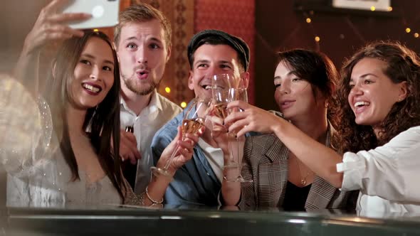 Young Cheerful Female Friends Taking Selfie In Pub Using Phone. Friends, Men, Women, Leisure