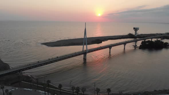 Aerial view of Anaklia-Ganmuhkuri Pedestrian Bridge at colourful sunset