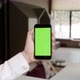 Handheld Camera: Point of View of Woman at Phone with Green Screen for Copy Space. Chromakey - VideoHive Item for Sale
