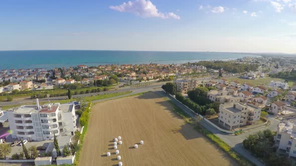 Aerial Shot of Luxury Villas Along Coastline. Blue Sky, Sunny Day, Summer Resort