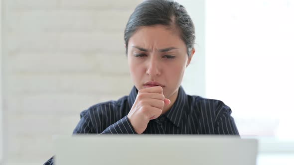 Close Up of Indian Woman with Laptop Coughing 