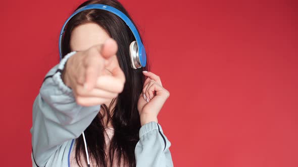 Happy Young Girl in Sportswear Listening To Music