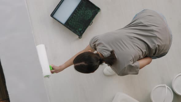 Top View of Woman Painting Wall at Home