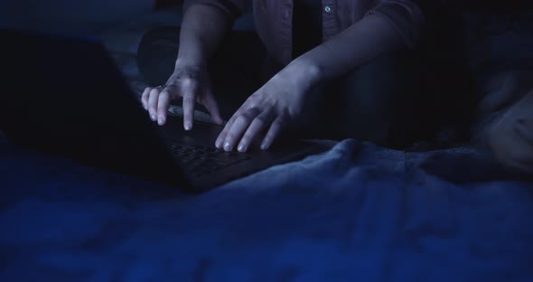 Hands of woman using a laptop