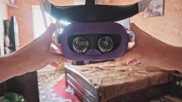 POV of Putting on VR Glasses Virtual Reality in the Bedroom