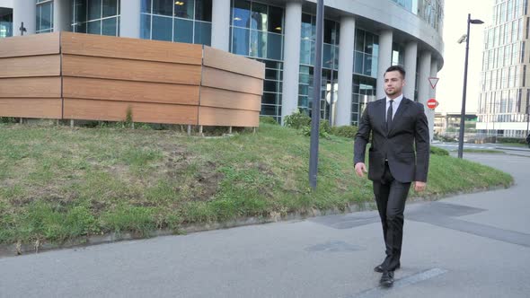 Walking Young Businessman to Office