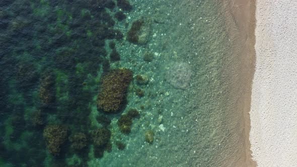 Aerial View on Calm Azure Sea and Volcanic Rocky Shores