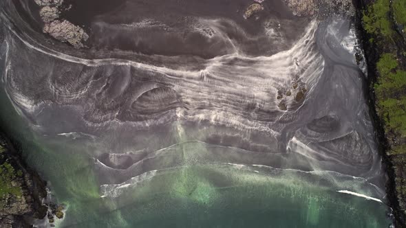 Aerial view of abstract pattern created by a red sand beach, Faroe island.