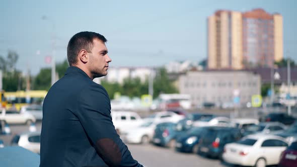 Close View Handsome Young Man in Blue Jacket Against City