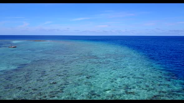 Aerial top down abstract of relaxing seashore beach trip by blue green sea with white sandy backgrou