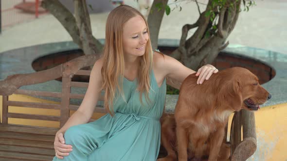 Young Woman Visits a Dog Farm, Where You Can Hang Out with Lots of Cute and Adorable Dogs