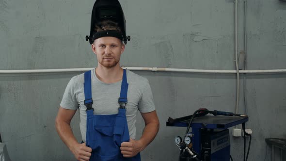 Portrait of Young Metalwork Trainee in Workshop Mechanic Welder in Factory Car