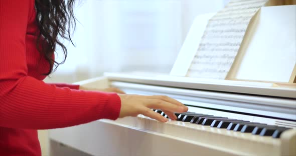 Woman or Girl A Student or Professional Pianist Plays Classical Music on a Beautiful White Piano