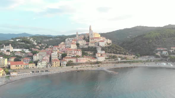 Aerial: flying around Cervo medieval town on the mediterranean coast, Liguria riviera, Italy
