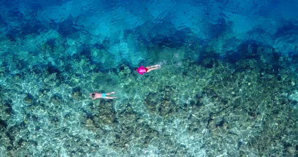 Romantic man and woman on romantic honeymoon live the dream on beach on paradise white sand 