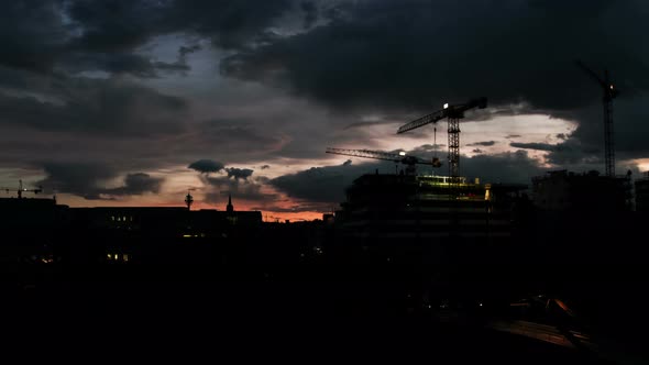 Time Lapse Crane Moving on Construction Site at Sunset in Vienna Austria