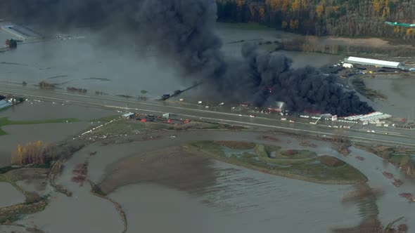 Massive Fire Burning RV Caravans With Thick Black Smoke Amidst The Ravaging Floods In Abbotsford, BC