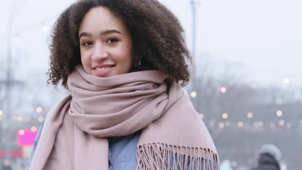 Portrait of Smiling Young Curlyhaired Mixed Race African American Girl Woman with Stylish Afro