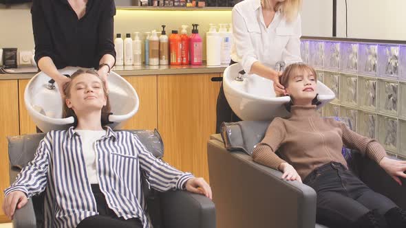 Young and Beautiful Woman Get Beauty Procedures in Hair Saloon