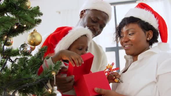 African Family Opening Christmas Gift at Home