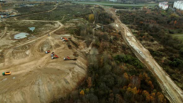 Construction site in a city vacant lot. Photographed in cloudy weather. Aerial photography.