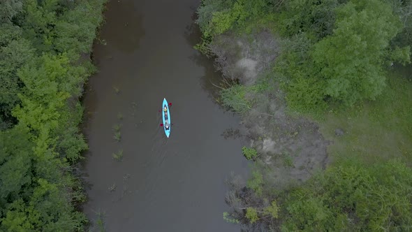 The Kayak Floats Along the River