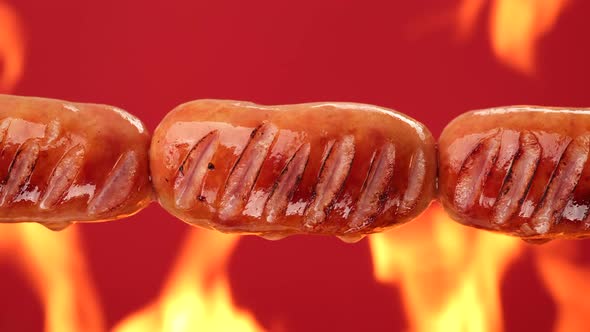 Fry sausages on open fire