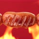 Fry sausages on open fire - VideoHive Item for Sale