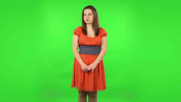 Cute Girl Is Scared, Then Smiles and Sighs in Relief. Green Screen