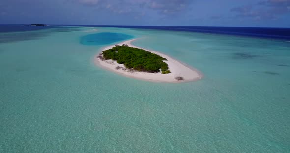 Luxury above abstract shot of a summer white paradise sand beach and blue ocean background in colour