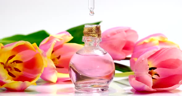 Pink oil essence flower product. Aroma liquids.  Perfumery