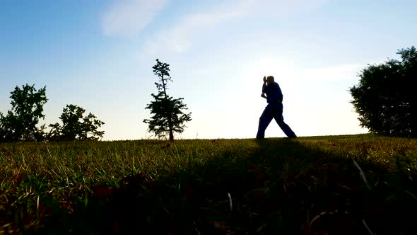 Boxer Training Outside at Sunrise, Practicing Hit, Meditation and Recreation