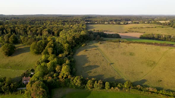Green English Mapledurham countryside, Berkshire county in UK. Aerial forward