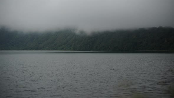 Bali timelapse lake beratan with foggy hill 
