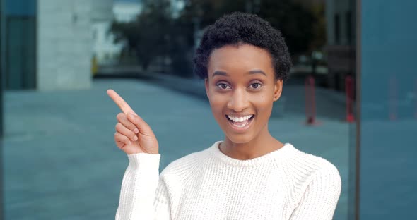 Portrait of Smiling Young African American Woman Female Teenager Student Girl in White Stands Posing