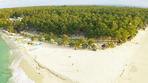 Aerial View of Paradise White Sand Beach and Azure Sea on Tropical Daku Island in Siargao