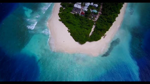 Aerial scenery of relaxing lagoon beach vacation by blue sea and white sandy background of a dayout 