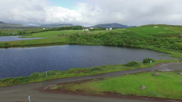 Aerial view of lakes and green fields