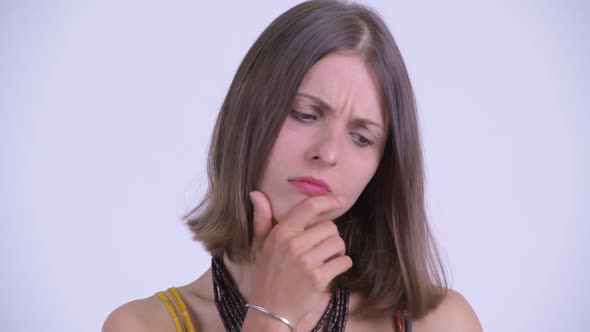 Face of Young Serious Hipster Woman Thinking and Looking Down