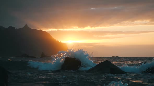 Waves Rise in the Air at Beautiful Sunset Light at Benijo Beach in Tenerife, Canary Islands