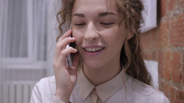 Female Talking on Mobile Phone, Discussing an Issue