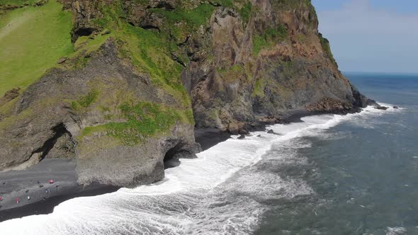 Basalt columns and a cave at Reynisfjara black sand beach in Iceland